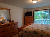 queen bedroom with door to north deck